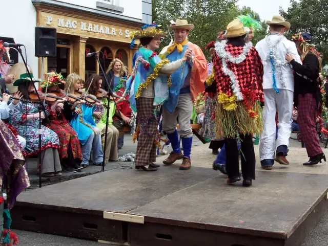 Wren Boys in straw suits and bright costumes performing at Bunratty